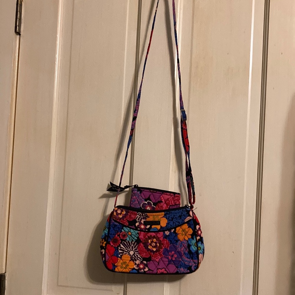 Vera Bradley crossbody purse and small zippered pouch.